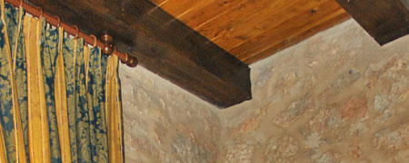 Travi in legno e pareti in pietra